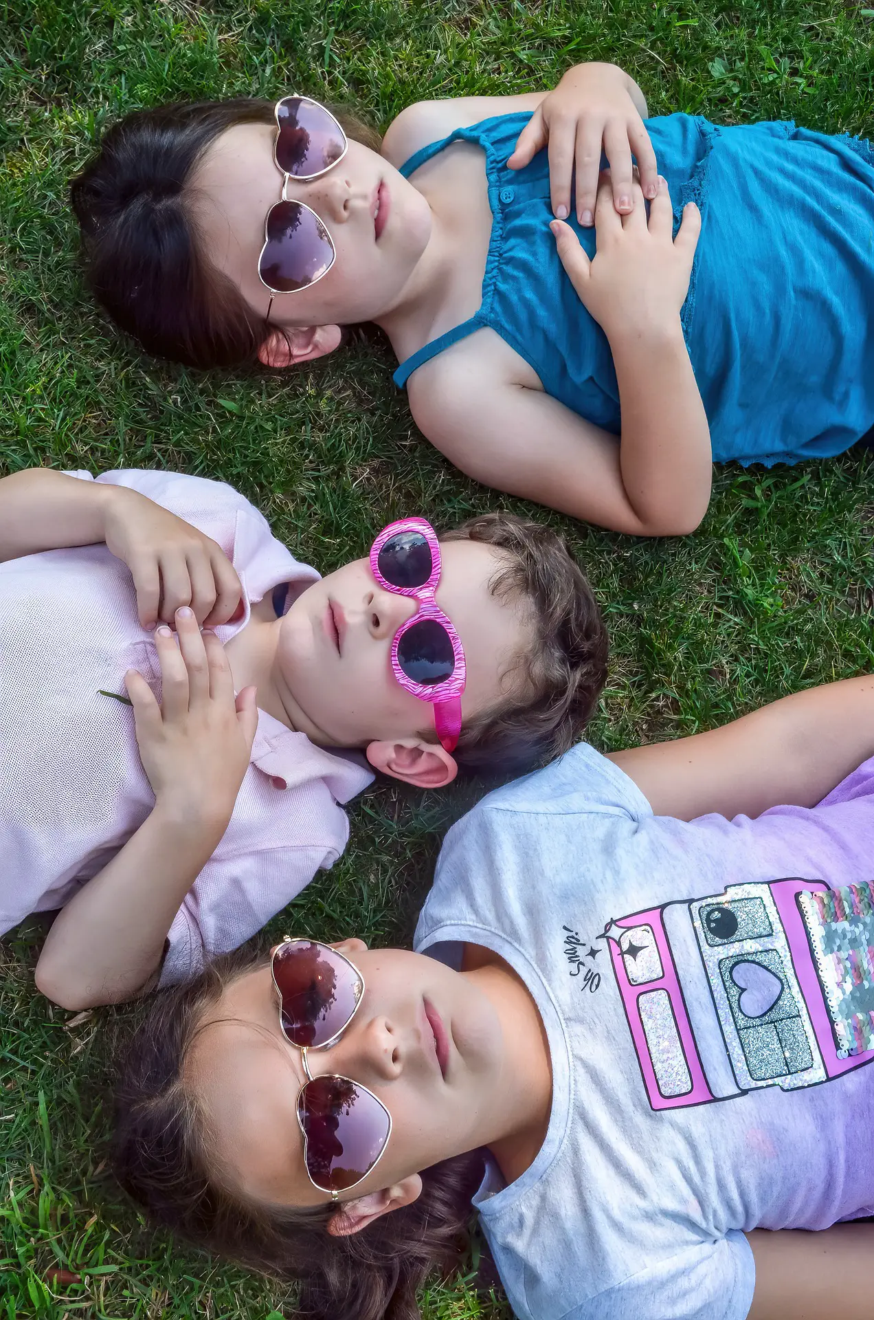 3 kids wearing sunglasses
