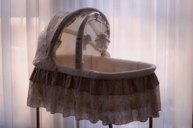 Bassinet with toys